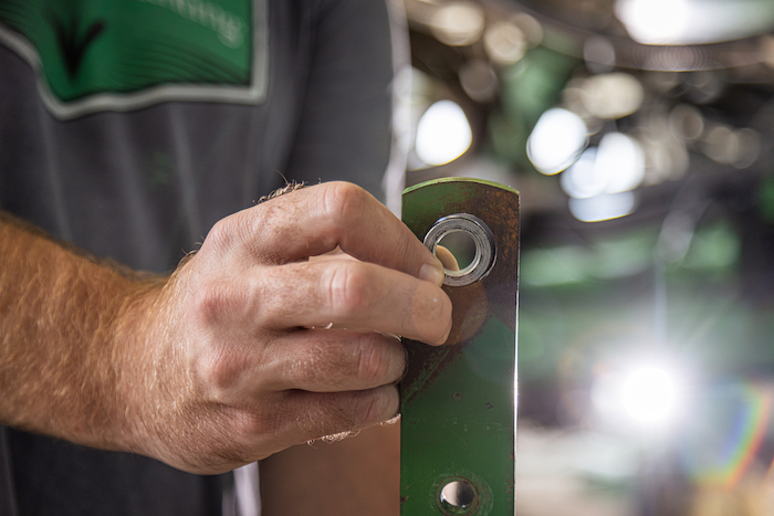 In this photo, you can see a large gap between the bushing and the parallel linkage, indicative of severe wear to the parallel arm.